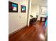 Home office with modern desk and chair, recessed lighting, and wood flooring at 855 Peachtree Ne St # 1406, Atlanta, GA 30308