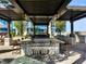 Outdoor kitchen boasting a large stainless steel grill and bar seating perfect for entertaining at 855 Peachtree Ne St # 1406, Atlanta, GA 30308