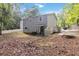 Backyard with a deck, stairs, mature trees, and ample room for outdoor activities at 2100 Scarbrough Rd, Stone Mountain, GA 30088