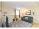 A comfortable basement with a carpeted area, a window, and decor at 2100 Scarbrough Rd, Stone Mountain, GA 30088