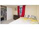 Cozy bedroom with closet, warm lighting, and comfortable bed and furniture at 2100 Scarbrough Rd, Stone Mountain, GA 30088