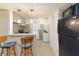 Charming kitchen featuring a counter bar and modern appliances at 2100 Scarbrough Rd, Stone Mountain, GA 30088