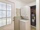 Convenient laundry area with stacked washer/dryer and access to utilities at 2100 Scarbrough Rd, Stone Mountain, GA 30088