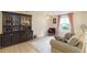 Cozy living room with hardwood floors, soft lighting, and comfortable furnishings at 2100 Scarbrough Rd, Stone Mountain, GA 30088