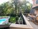 Backyard view featuring pool, white fence, and outdoor dining on deck at 3120 Saint Andrews Cir, Duluth, GA 30096