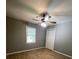 Neutral bedroom boasts hardwood floors and a ceiling fan at 3120 Saint Andrews Cir, Duluth, GA 30096