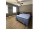 Spacious bedroom featuring hardwood floors and a ceiling fan at 3120 Saint Andrews Cir, Duluth, GA 30096