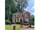Beautiful two-story brick home with lush landscaping at 3120 Saint Andrews Cir, Duluth, GA 30096