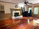 Cozy living room featuring a fireplace and hardwood floors at 3120 Saint Andrews Cir, Duluth, GA 30096