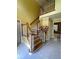 Bright foyer featuring a wood staircase with white railings and tile flooring at 3120 Saint Andrews Cir, Duluth, GA 30096