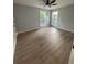Bright bedroom with large windows, ceiling fan, and neutral decor at 3189 Jackson, Hapeville, GA 30354
