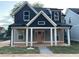 Charming two-story home with a welcoming front porch and a beautifully landscaped yard at 3189 Jackson, Hapeville, GA 30354