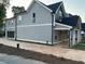 Exterior view of a well-maintained two-story home with a private driveway and lush greenery at 3189 Jackson, Hapeville, GA 30354