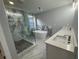 Elegant main bathroom with marble shower, freestanding tub, and double vanity sinks at 3189 Jackson, Hapeville, GA 30354