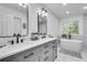 Luxurious bathroom featuring a double vanity, a soaking tub, and a stylish modern design at 3250 Cobbs Farm Nw Trl, Marietta, GA 30064