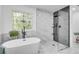 Elegant bathroom with a soaking tub under a stained glass window and a glass enclosed shower at 3250 Cobbs Farm Nw Trl, Marietta, GA 30064