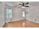 Bedroom with natural light, hardwood floors, and ceiling fan at 3250 Cobbs Farm Nw Trl, Marietta, GA 30064