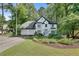 Charming two-story home with three-car garage and beautifully landscaped front yard at 3250 Cobbs Farm Nw Trl, Marietta, GA 30064