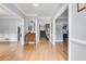 Bright foyer with hardwood floors, light gray walls, white trim, and elegant staircase at 3250 Cobbs Farm Nw Trl, Marietta, GA 30064