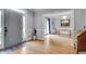 Inviting foyer with hardwood floors, gray walls, wainscotting, and sidelight windows at 3250 Cobbs Farm Nw Trl, Marietta, GA 30064