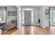 Welcoming foyer with hardwood floors, gray walls, and sidelight windows at 3250 Cobbs Farm Nw Trl, Marietta, GA 30064