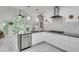 Bright kitchen with stainless steel appliances, white cabinets, and a large window overlooking a wooded area at 3250 Cobbs Farm Nw Trl, Marietta, GA 30064