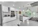 Spacious kitchen featuring white cabinetry, stainless steel appliances, and a large window with natural light at 3250 Cobbs Farm Nw Trl, Marietta, GA 30064