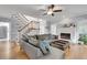 Spacious living room with hardwood floors, fireplace, staircase, and plenty of natural light at 3250 Cobbs Farm Nw Trl, Marietta, GA 30064
