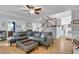 Spacious living room with hardwood floors, fireplace, staircase, and comfortable seating at 3250 Cobbs Farm Nw Trl, Marietta, GA 30064