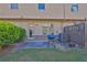 The backyard features a patio, a grill, an AC unit, greenery, and access to the house at 328 Oaktown Ct, Lawrenceville, GA 30044