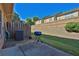 The backyard features a concrete patio, an AC unit, a grill, a wooden fence, and some greenery at 328 Oaktown Ct, Lawrenceville, GA 30044