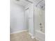 Bright bathroom featuring a shower-tub combination at 328 Oaktown Ct, Lawrenceville, GA 30044