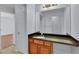 Vanity with wood cabinets and granite countertop in the bathroom at 328 Oaktown Ct, Lawrenceville, GA 30044