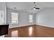 This bedroom features a ceiling fan and windows for natural light at 328 Oaktown Ct, Lawrenceville, GA 30044