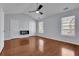 This bedroom features a ceiling fan and windows for natural light at 328 Oaktown Ct, Lawrenceville, GA 30044