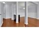 Dining area featuring hardwood floors, a light fixture, and a bar storage cabinet at 328 Oaktown Ct, Lawrenceville, GA 30044