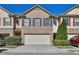Charming brick townhome featuring a two-car garage and manicured landscaping in a well-maintained community at 328 Oaktown Ct, Lawrenceville, GA 30044