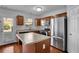 Bright kitchen with wood cabinets, stainless appliances, and a kitchen island at 328 Oaktown Ct, Lawrenceville, GA 30044