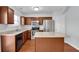 Well-equipped kitchen with wooden cabinets, stainless steel appliances, and center island at 328 Oaktown Ct, Lawrenceville, GA 30044