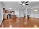 Open-concept kitchen with wooden cabinets, stainless steel appliances, and hardwood floors at 328 Oaktown Ct, Lawrenceville, GA 30044