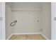 Inside laundry room includes tile floors and storage shelf at 328 Oaktown Ct, Lawrenceville, GA 30044