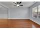 Well-lit living room featuring hardwood floors and a large window for ample natural light at 328 Oaktown Ct, Lawrenceville, GA 30044