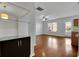 Open-concept living room features hardwood floors, a ceiling fan and easy access to the outdoors at 328 Oaktown Ct, Lawrenceville, GA 30044