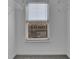 Walk-in closet featuring carpet floors and storage shelves with a window at 328 Oaktown Ct, Lawrenceville, GA 30044