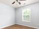 Cozy bedroom with hardwood floors and window bringing in natural light at 532 Oakside Pl, Acworth, GA 30102