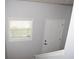 Stairwell with natural light from window and an entry door, painted in a neutral color at 532 Oakside Pl, Acworth, GA 30102
