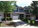 Attractive townhome showcasing a well-maintained lawn, neutral siding and a convenient driveway at 532 Oakside Pl, Acworth, GA 30102