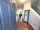 Open foyer with hardwood floors, stylish decor and easy access to the rest of the home at 532 Oakside Pl, Acworth, GA 30102