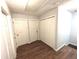 Hallway with three white doors and a ceiling access panel on the textured ceiling at 532 Oakside Pl, Acworth, GA 30102