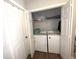 Laundry closet featuring side-by-side washer and dryer units at 532 Oakside Pl, Acworth, GA 30102